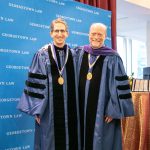 Prof. Brad Snyder poses with Dean Treanor at a Feb. 28 ceremony honoring five new named professors.