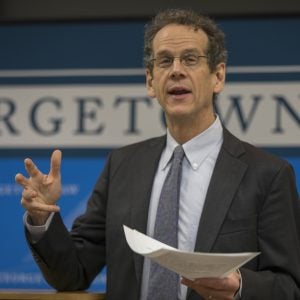 A man in a suit and tie, speaking at a Georgetown Law event