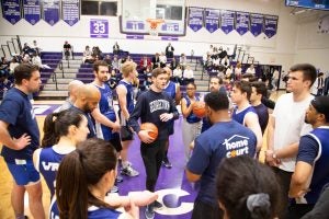 Hoya Lawyas coach Chase Gordon, L'24, at center, psyching up his team.