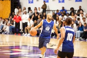 A basketball player dribbling the basketball