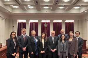 2024 Beaudry Competition finalists pose with members of the judging panel. L-R: Attorney Zoe Jacoby; Luke Dykowski, L’26; Prof. Laura Donohue; Jen Fridman, L'26; Judge Anthony Trenga; Judge Timothy Kelly, L'97; Allyson Rosenblum, L'26; Talia Paskuski, L’26, and attorney Gregory Cui.