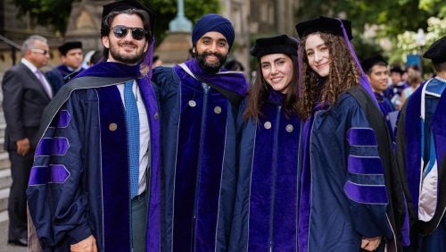 Four students pose for a photo at Sunday's Commencement Ceremony.