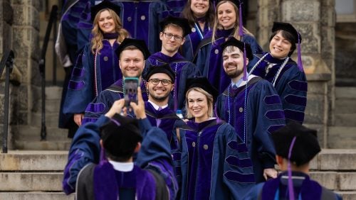 Students pose for a photo on the Georgetown University campus.