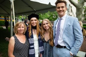 Class of 2024 graduate Aubrianna Mierow poses for a picture with her mother, sister and partner.