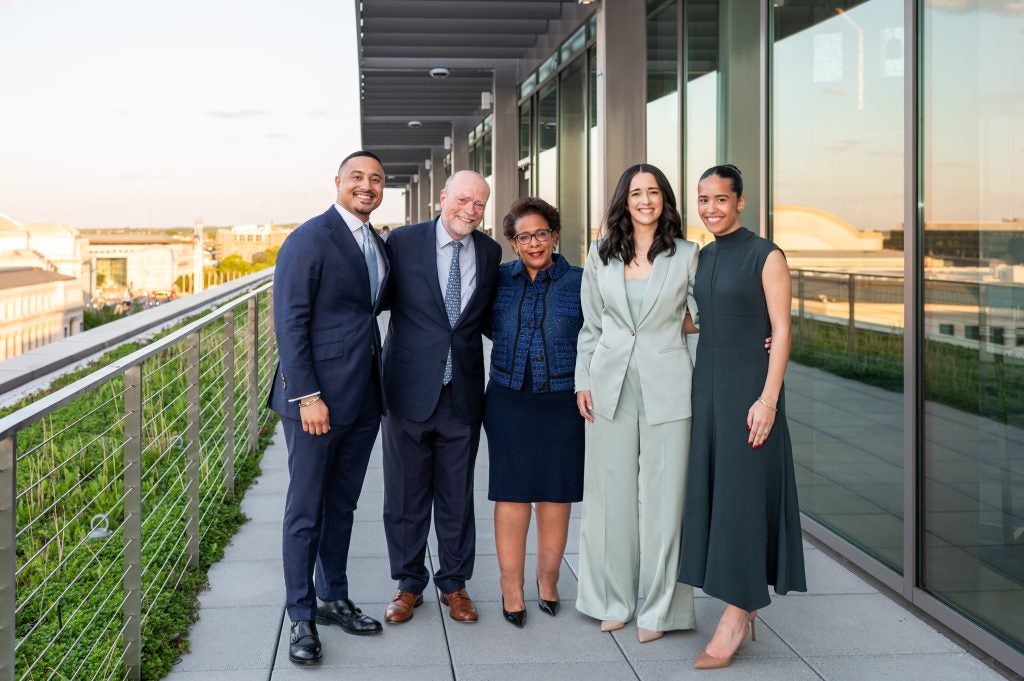 L-R: Georgetown Law Journal Volume 112 Senior Development Editor Garett Eldred, L'24; Dean William M. Treanor; former U.S. Attorney General Loretta Lynch; outgoing Editor-in-Chief Alexis Marvel, L'24; incoming Editor-in-Chief Yasmeen Rose, L'25.