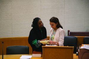 Juvenile Justice Clinic Director Professor Kristin Henning, L'87, advising student Deena Dulgerian, L'17, before a 2016 court hearing.