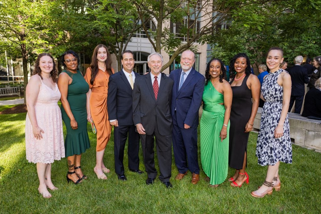 A group of people attending a reception on the Georgetown Law campus