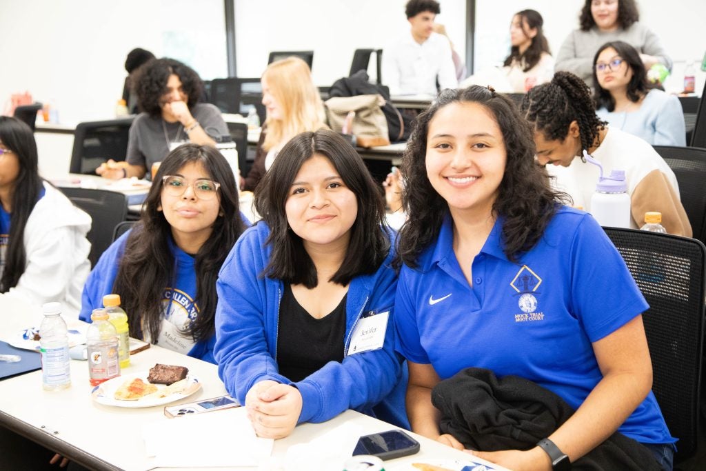 Bryant High senior Leysy Yaguana and her classmates pose for a photo during a classroom visit at the Law Center this spring.