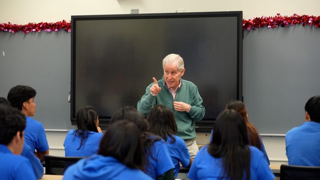 Cornblatt addresses a group of students during his February visit to Bryant High.
