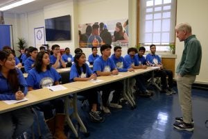 Georgetown Law Dean of Admissions Andy Cornblatt (right) speaks with students at William Cullen Bryant High School in New York.