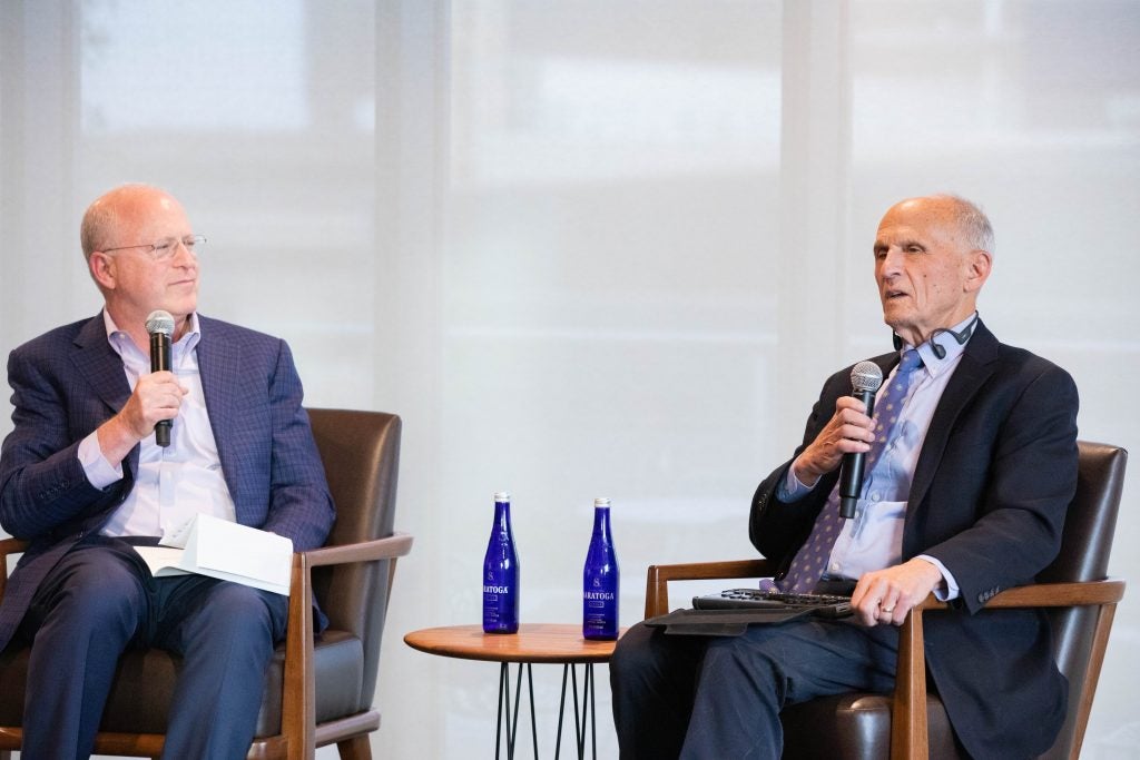 Professor from Practice Cliff Sloan and Judge David S. Tatel pictured onstage together.