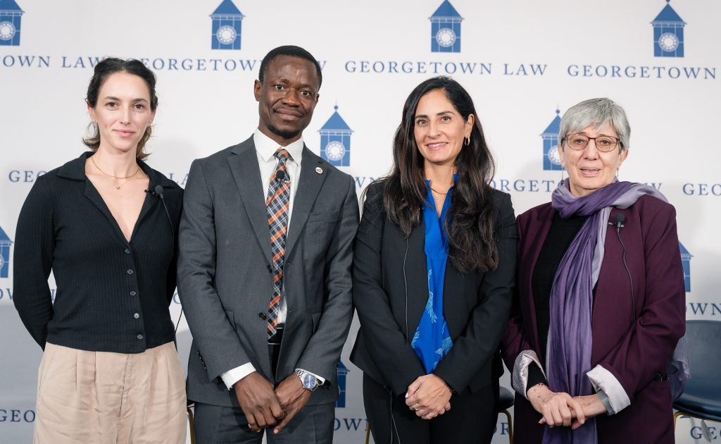 Panelists Pema Levy, Dr. Jean-Claude Muluna, Dr. Pardis Mahdavi and Dr. Sima Samar pose for a group photo.
