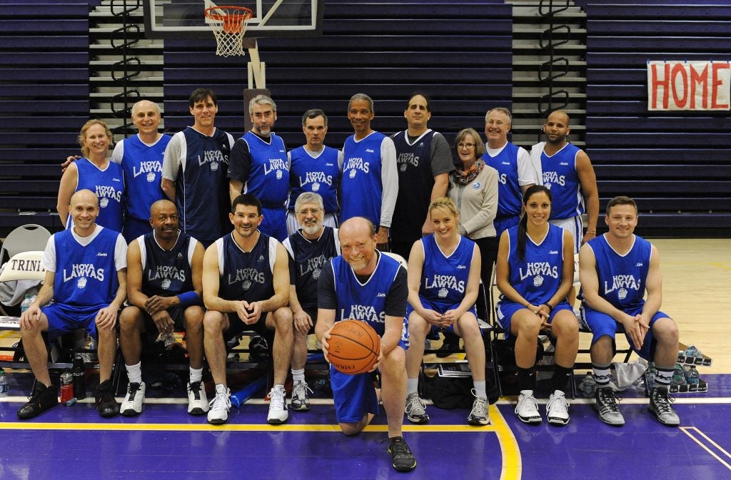 A basketball team wearing blue shirts