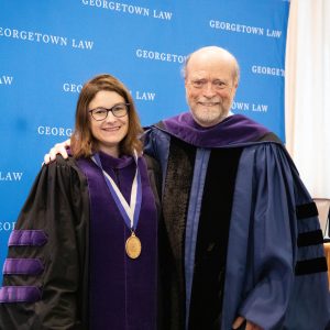 Prof. Maria Glover poses for a photo with Dean Treanor