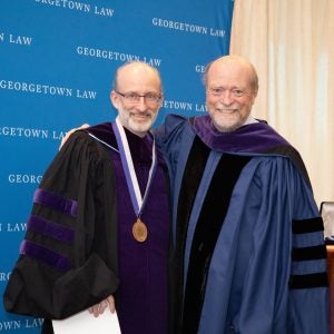 Prof. Brian Galle poses for a photo with Dean Treanor