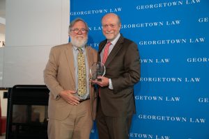 Professor J. Peter Byrne accepts his award from Dean William M. Treanor