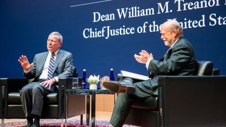 Chief Justice John Roberts pictured with Dean Treanor during the Lecture to the Graduating Class of 2025.