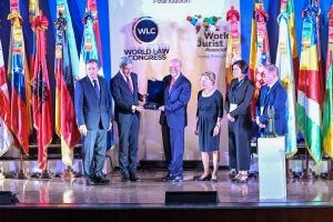 Dean William M. Treanor, center, with leadership of the World Jurist Association (Photo from WJA)