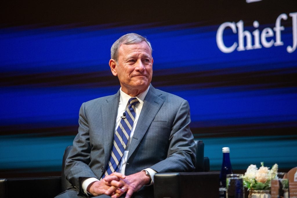 The Chief Justice pictured onstage in Hart Auditorium.