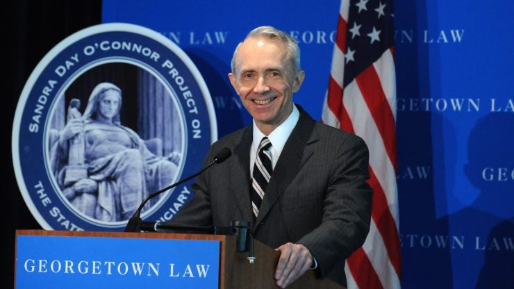 A man speaking at a podium