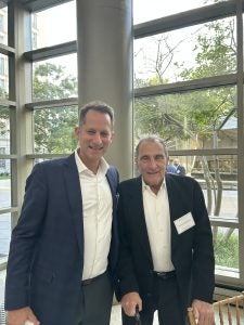 Two men standing side by side