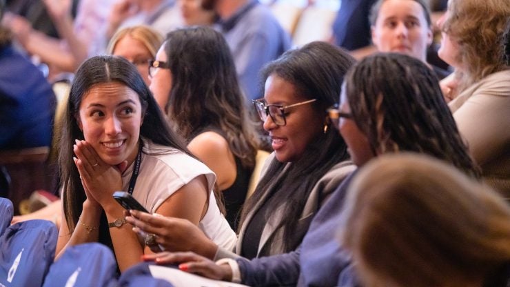Law students sitting in the audience at Georgetown's Gaston Hall