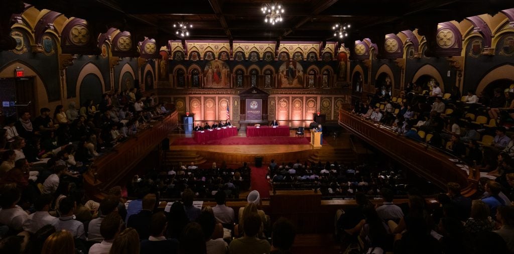 Georgetown Law's Gaston Hall, full of students watching a Law Faculty Moot