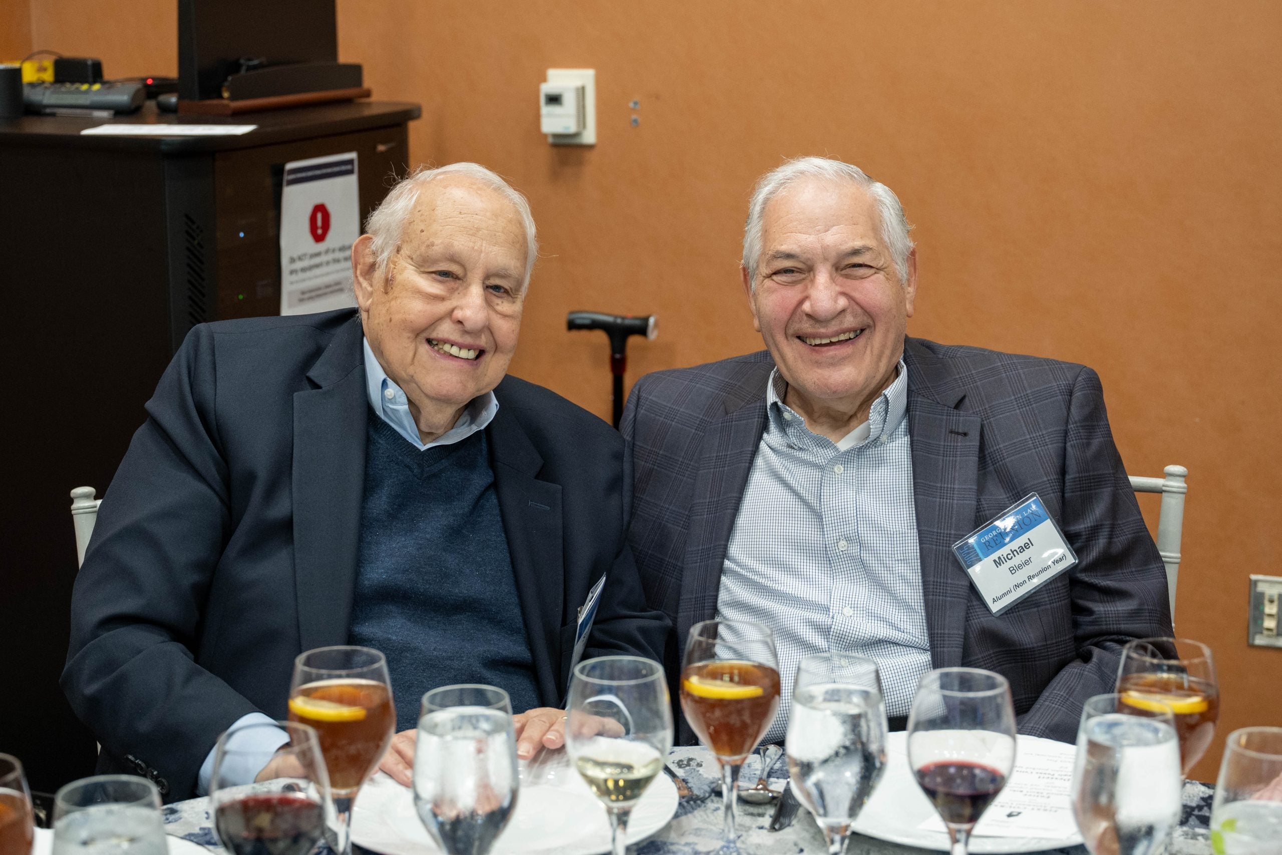Two Founders' Circle Luncheon attendees smile at lunch.