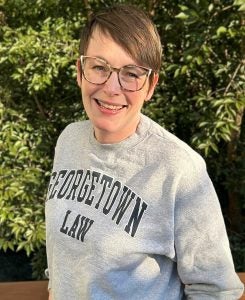 A woman wearing a Georgetown Law sweatshirt