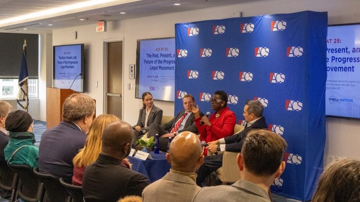 Panelists engage in discussion at the ACS 25th anniversary event on Jan. 12. L-R: ACS Georgetown Chapter President Tessa Freeman, L’27; ACS President Phil Brest; ACS Board Chair-Elect Professor Michele Goodwin; and ACS Board Chair Amb. Keith M. Harper (Ret.) discussed the organization’s history and role in the progressive legal movement at a Jan. 12 anniversary event. 