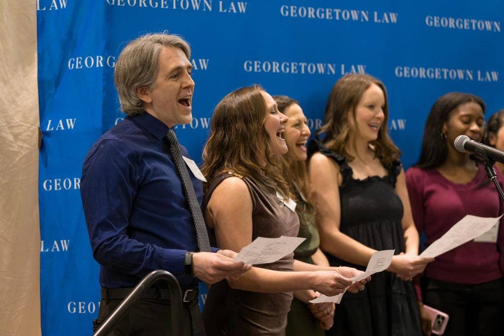 A group of people standing together and singing