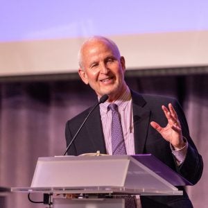A man speaking at a podium