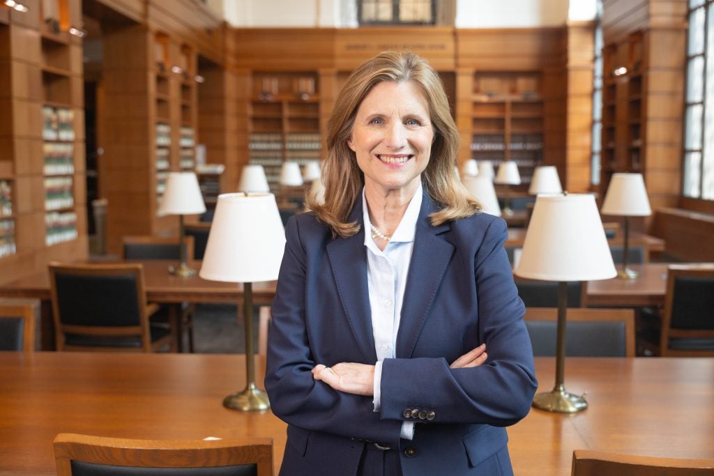 Georgetown Law Dean M. Elizabeth Magill, standing in the reading room of the Williams Law Library