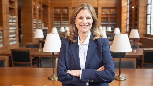 Georgetown Law Dean M. Elizabeth Magill, standing in the reading room of the Williams Law Library