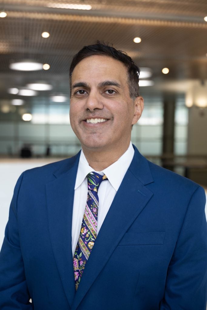 A man in a blue blazer
