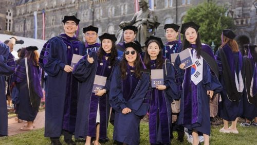 A group of law graduates pose for a photo during Commencement 2025.